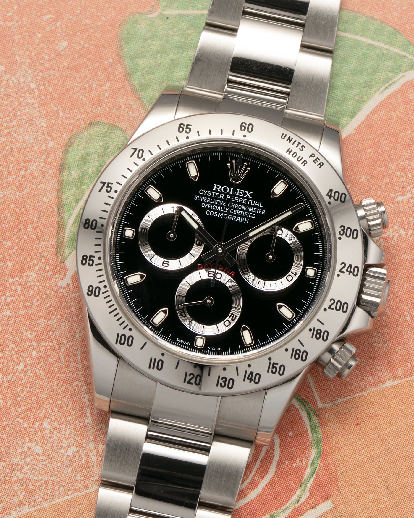 Brand: Rolex
Year: 2010s
Model: Cosmograph Daytona
Reference: 116520
Material: Stainless Steel
Movement: Rolex Cal. 4130, Self-Winding
Case Dimensions: 40mm x 12mm (Lug-to-Lug 47mm)
Lug Width: 20mm
Bracelet: Rolex Stainless Steel Oyster Bracelet with Signed Deployant Clasp