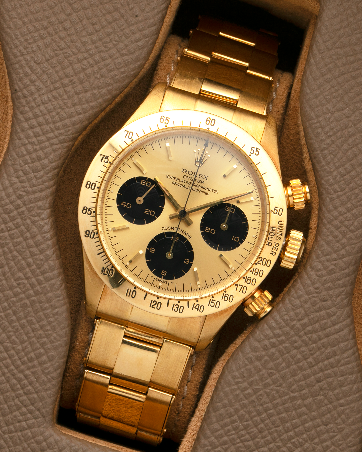 Brand: Rolex
Year: 1979
Model: Cosmograph Daytona
Serial Number: 595XXXX
Reference Number: 6265
Material: 18-carat Yellow Gold
Movement: Rolex Cal. 727 (Based on Valjoux Cal. 72), Manual-Winding
Case Diameter: 37.5mm x 13.5mm (Lug-to-Lug 45mm)
Lug Width: 19mm
Bracelet: Rolex Oyster Swiss Rivet Bracelet in 18-carat Yellow Gold with ‘57’ Curved End Links and Signed Clasp