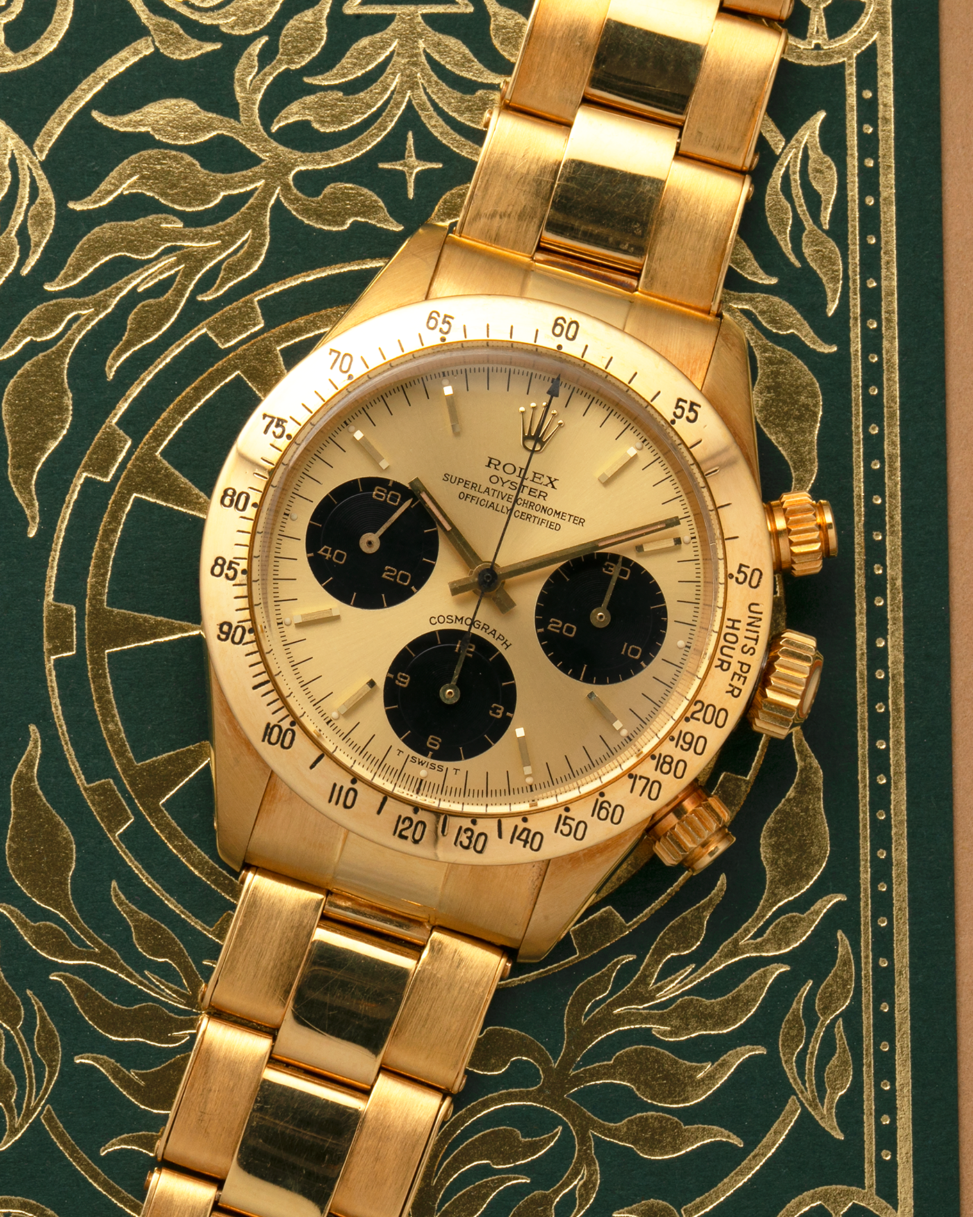 Brand: Rolex
Year: 1979
Model: Cosmograph Daytona
Serial Number: 595XXXX
Reference Number: 6265
Material: 18-carat Yellow Gold
Movement: Rolex Cal. 727 (Based on Valjoux Cal. 72), Manual-Winding
Case Diameter: 37.5mm x 13.5mm (Lug-to-Lug 45mm)
Lug Width: 19mm
Bracelet: Rolex Oyster Swiss Rivet Bracelet in 18-carat Yellow Gold with ‘57’ Curved End Links and Signed Clasp