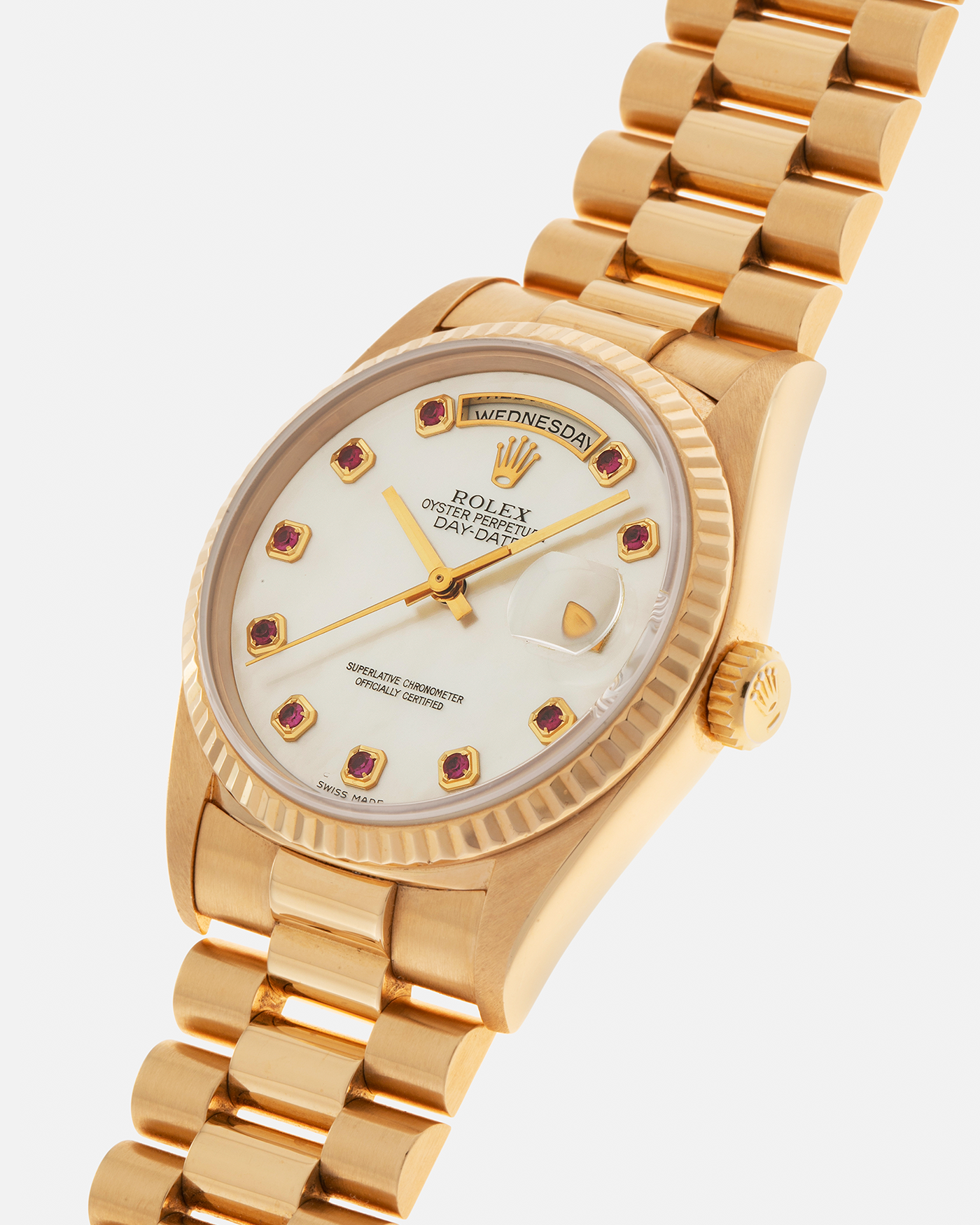 Brand: Rolex
Year: 1989
Model: Day-Date ‘Mother-of-Pearl Rubies’
Reference Number: 18238
Serial Number: L980XXX
Material: 18-carat Yellow Gold
Movement: Rolex Cal. 3155, Self-Winding
Case Dimensions: 36mm x 12mm (Lug-to-Lug 43.7mm)
Lug Width: 20mm
Bracelet: Rolex 18-carat Yellow Gold ‘8385’ Presidential Bracelet with 55B Curved End Links and Signed ‘O5’ Folding Clasp