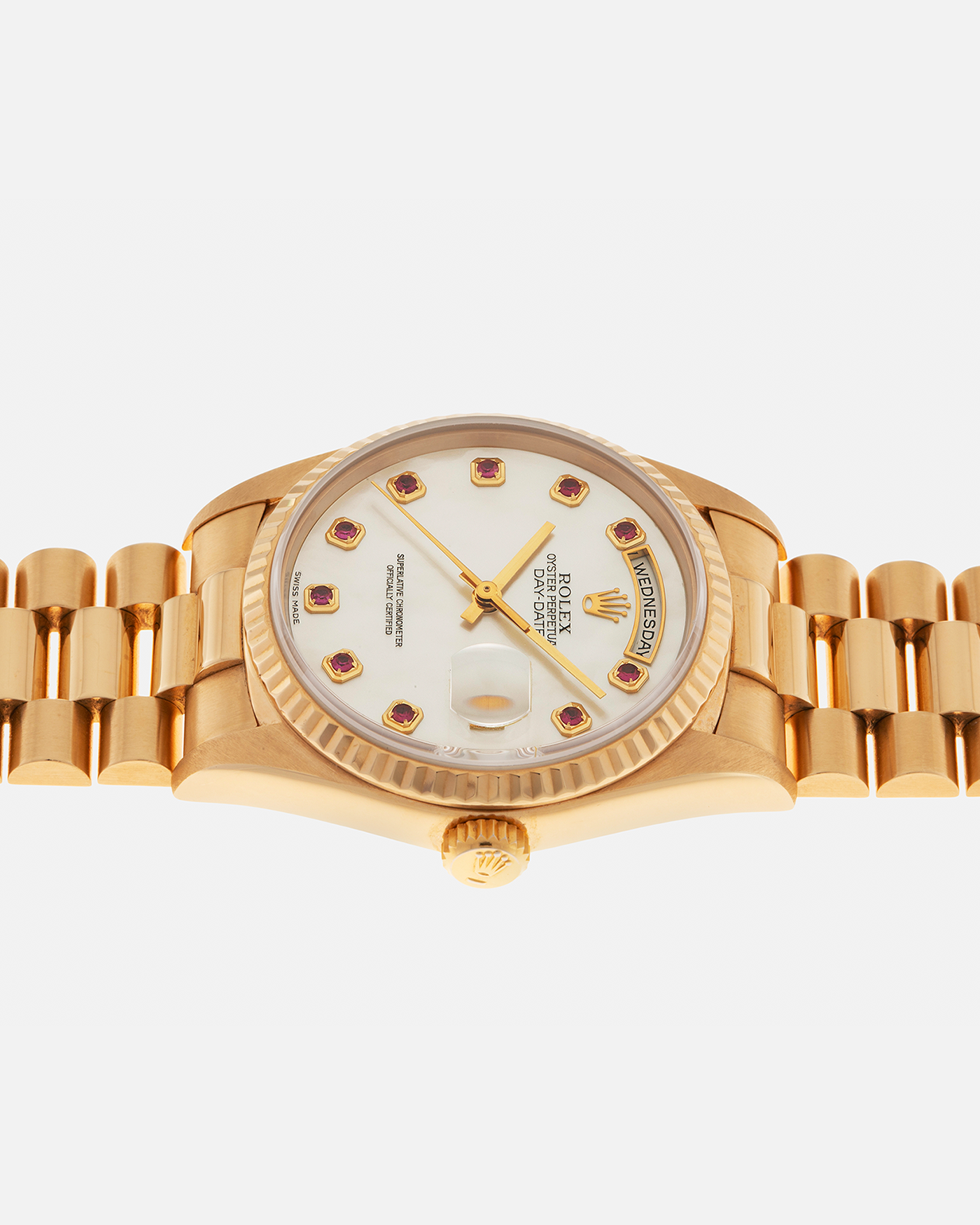 Brand: Rolex
Year: 1989
Model: Day-Date ‘Mother-of-Pearl Rubies’
Reference Number: 18238
Serial Number: L980XXX
Material: 18-carat Yellow Gold
Movement: Rolex Cal. 3155, Self-Winding
Case Dimensions: 36mm x 12mm (Lug-to-Lug 43.7mm)
Lug Width: 20mm
Bracelet: Rolex 18-carat Yellow Gold ‘8385’ Presidential Bracelet with 55B Curved End Links and Signed ‘O5’ Folding Clasp