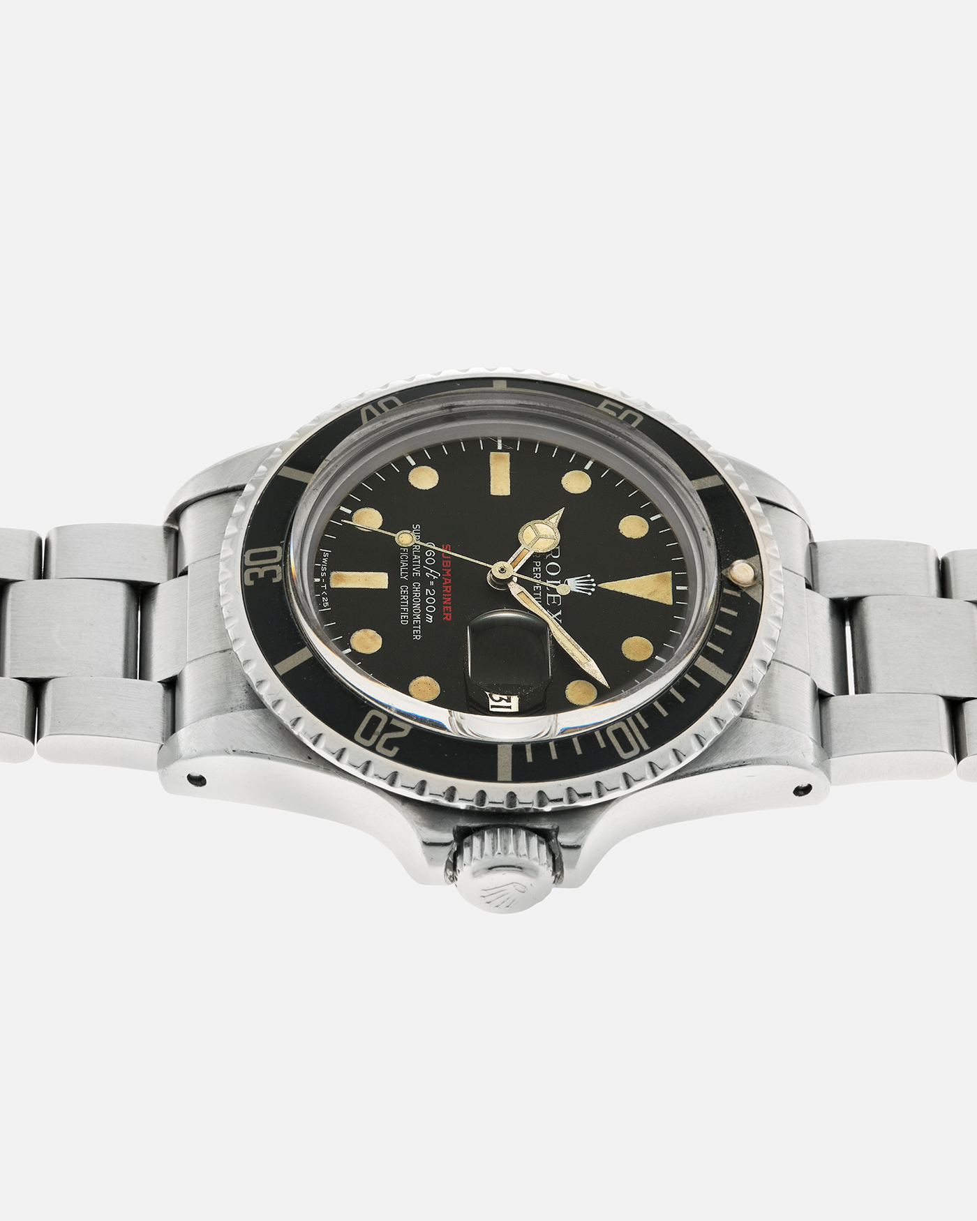 Brand: Rolex Year: 1970 Model: ‘Red’ Submariner Reference Number: 1680 Serial Number: 2437XXX Material: Stainless Steel Movement: Rolex Cal. 1570, Self-Winding Case Diameter: 40mm Lug Width: 20mm Bracelet: Rolex Stainless Steel ‘93150’ Oyster Bracelet with ‘580’ Endlinks