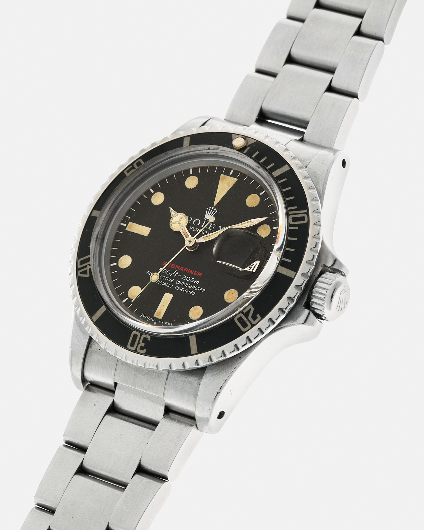 Brand: Rolex Year: 1970 Model: ‘Red’ Submariner Reference Number: 1680 Serial Number: 2437XXX Material: Stainless Steel Movement: Rolex Cal. 1570, Self-Winding Case Diameter: 40mm Lug Width: 20mm Bracelet: Rolex Stainless Steel ‘93150’ Oyster Bracelet with ‘580’ Endlinks