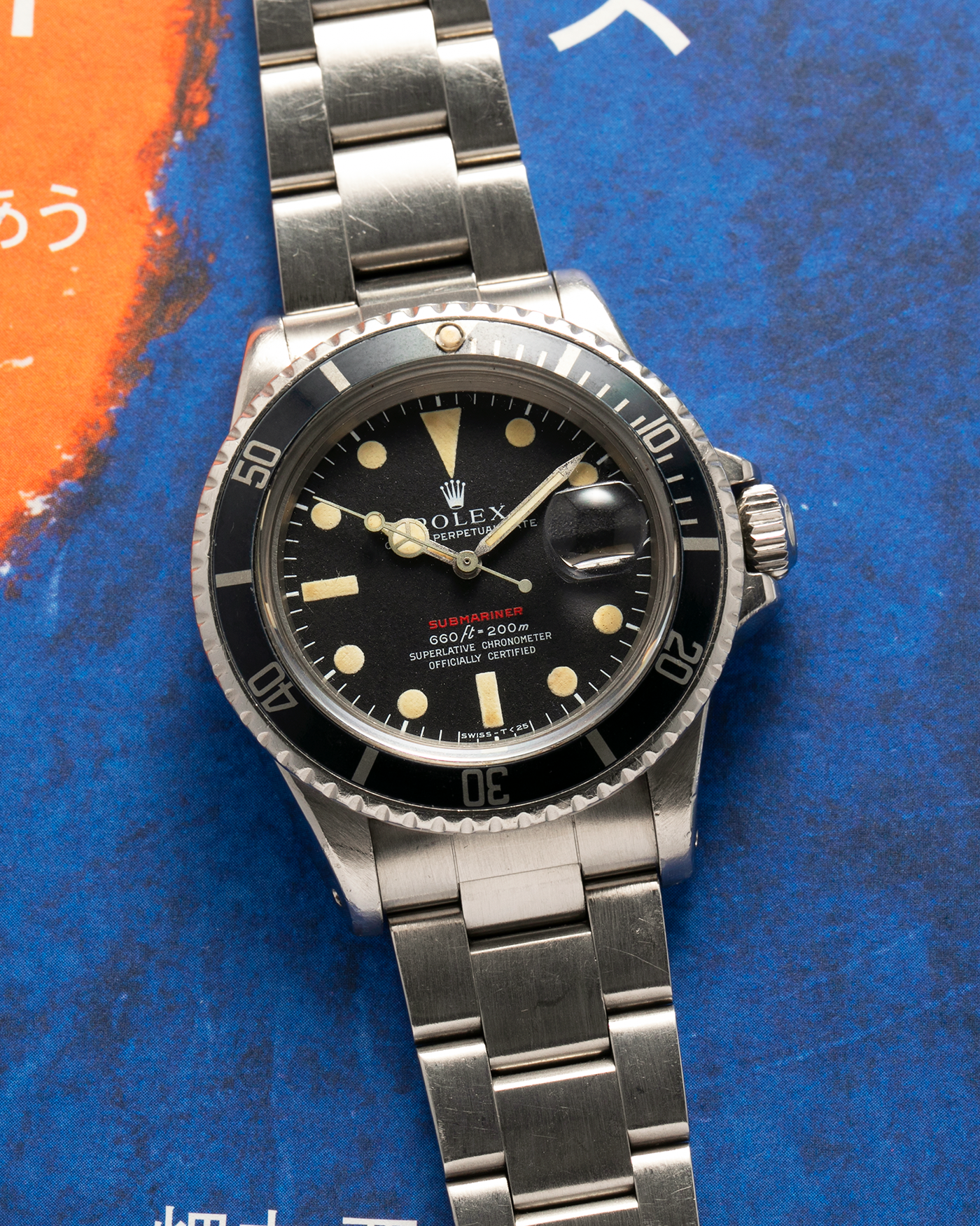 Brand: Rolex Year: 1970 Model: ‘Red’ Submariner Reference Number: 1680 Serial Number: 2437XXX Material: Stainless Steel Movement: Rolex Cal. 1570, Self-Winding Case Diameter: 40mm Lug Width: 20mm Bracelet: Rolex Stainless Steel ‘93150’ Oyster Bracelet with ‘580’ Endlinks