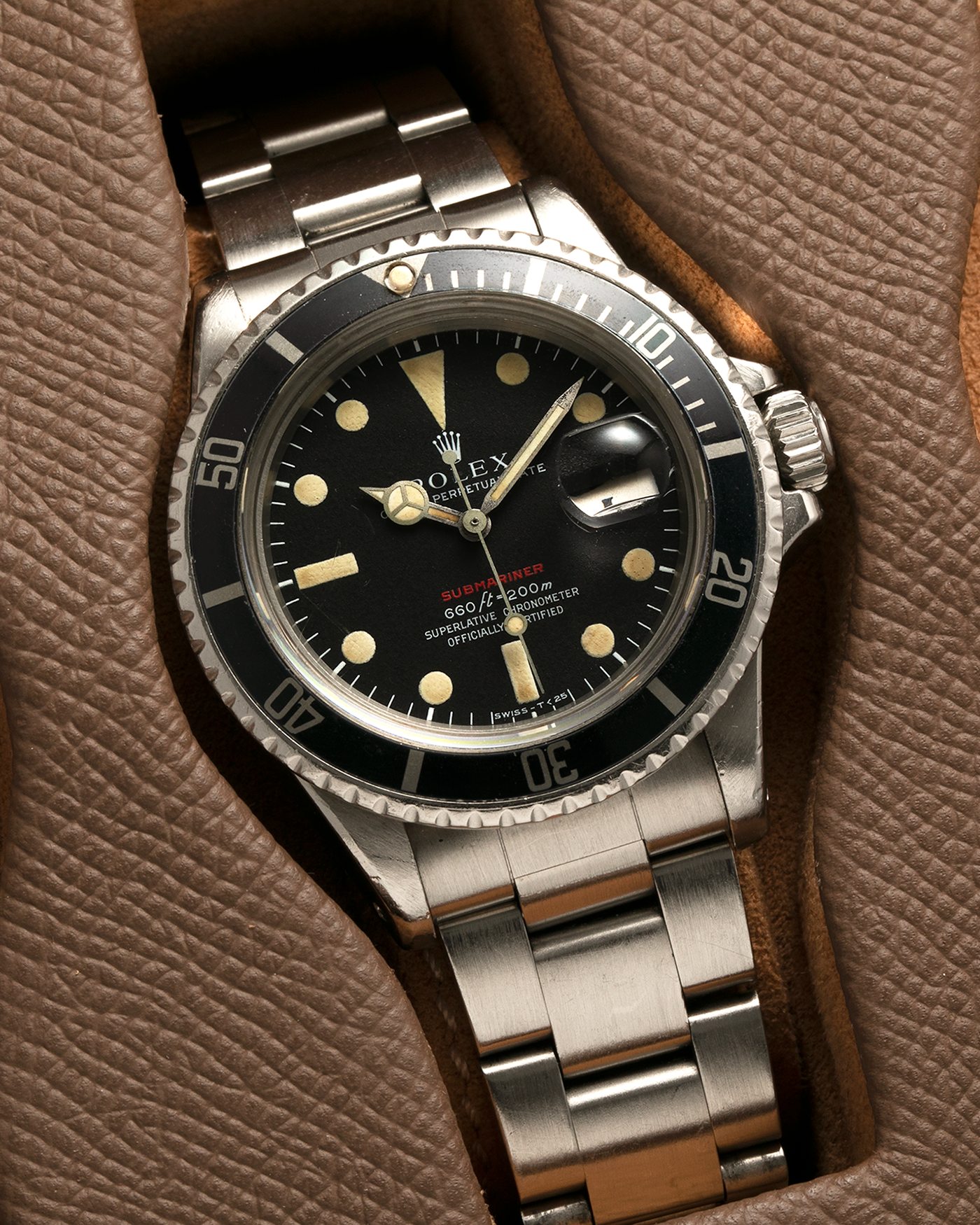 Brand: Rolex Year: 1970 Model: ‘Red’ Submariner Reference Number: 1680 Serial Number: 2437XXX Material: Stainless Steel Movement: Rolex Cal. 1570, Self-Winding Case Diameter: 40mm Lug Width: 20mm Bracelet: Rolex Stainless Steel ‘93150’ Oyster Bracelet with ‘580’ Endlinks