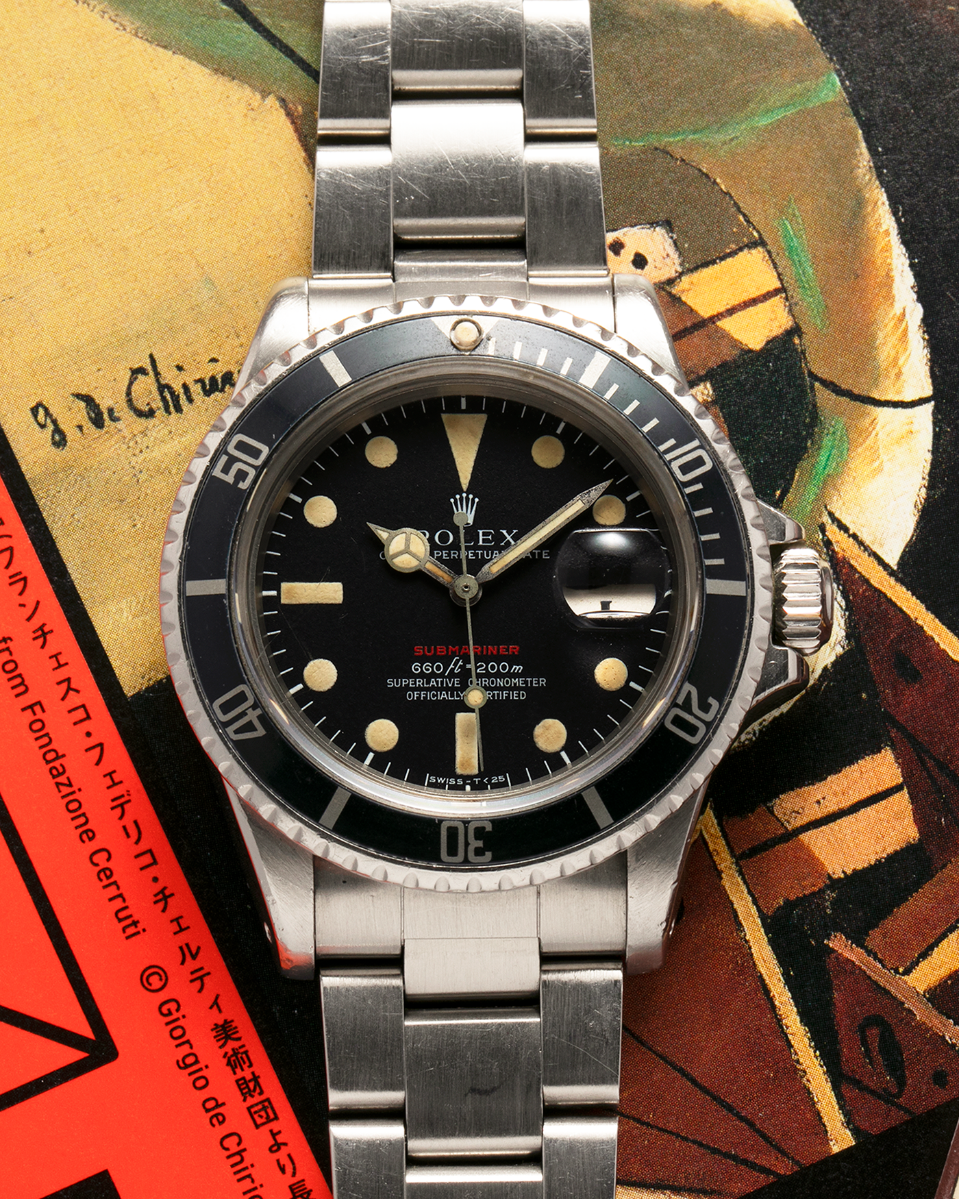 Brand: Rolex Year: 1970 Model: ‘Red’ Submariner Reference Number: 1680 Serial Number: 2437XXX Material: Stainless Steel Movement: Rolex Cal. 1570, Self-Winding Case Diameter: 40mm Lug Width: 20mm Bracelet: Rolex Stainless Steel ‘93150’ Oyster Bracelet with ‘580’ Endlinks