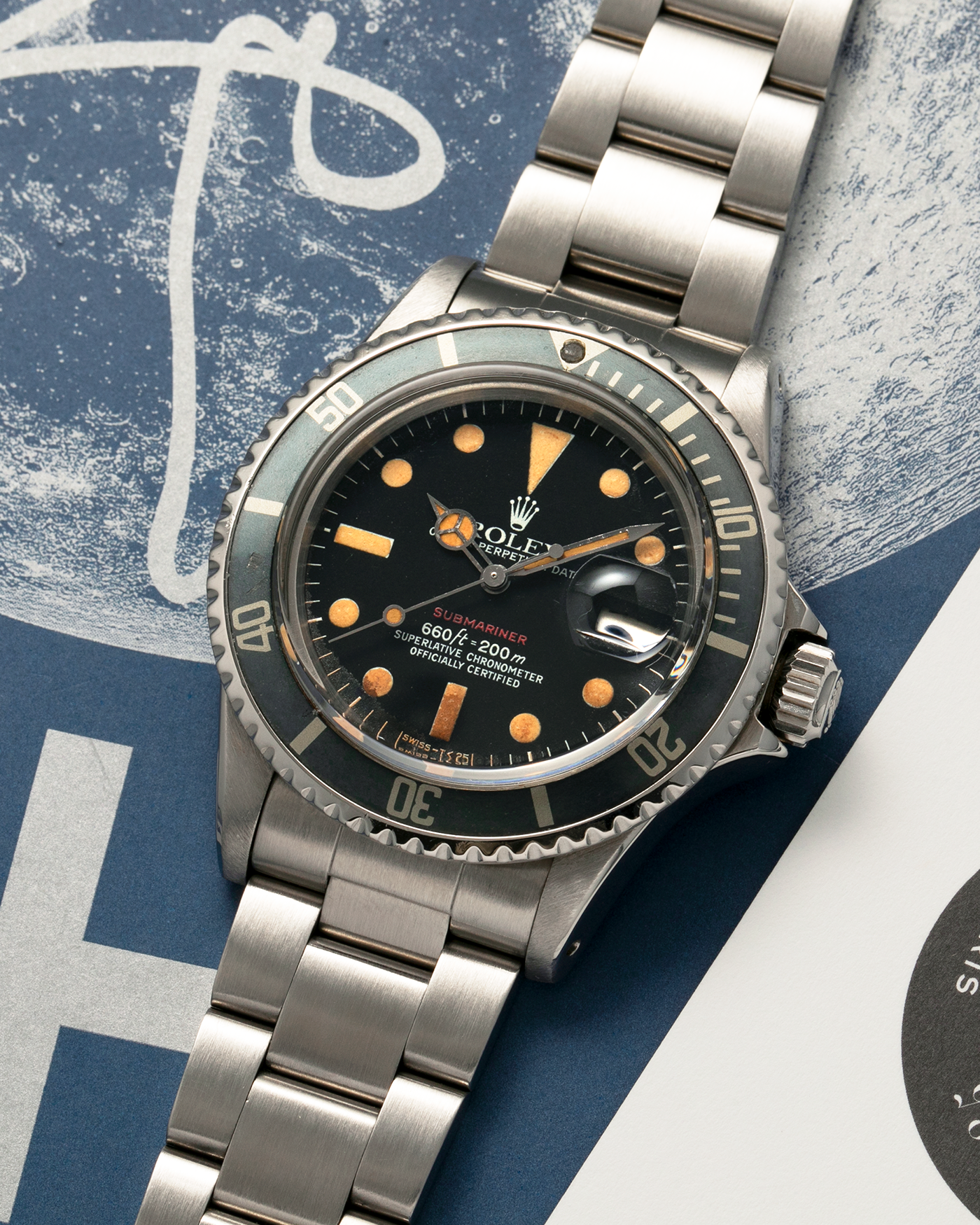 Brand: Rolex
Year: 1974
Model: ‘Red’ Submariner
Reference Number: 1680
Serial Number: 3740XXX
Material: Stainless Steel
Movement: Rolex Cal. 1575, Self-Winding
Case Diameter: 40mm x 14.8mm (with Crystal) (Lug-to-Lug 47.5mm)
Lug Width: 20mm
Bracelet: Rolex Stainless Steel ‘78360’ Oyster Solid Link Bracelet with ‘580’ Endlinks with ‘F’ Marked Folding Clasp