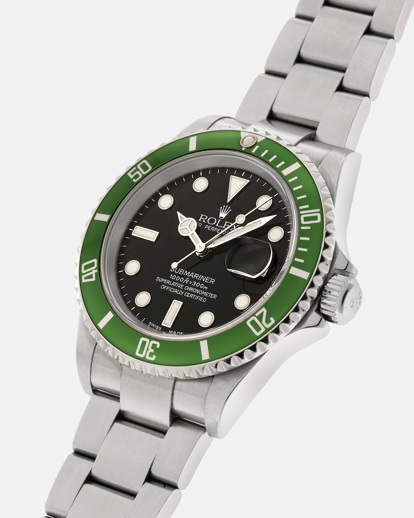 Brand: Rolex Year: 2004 Model: Submariner ‘Kermit’ Reference Number: 16610LV ‘Flat 4’ Serial Number: F Serial Material: Stainless Steel Movement: Rolex Cal. 3135, Self-Winding Case Diameter: 40mm Lug Width: 20mm Bracelet: Rolex Stainless Steel ‘93250’ Oyster Bracelet with signed ‘CL3’ Clasp