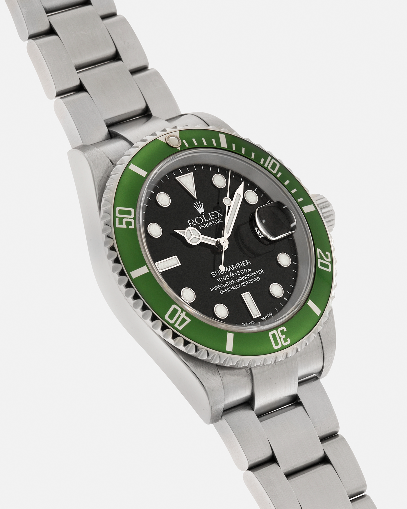 Brand: Rolex Year: 2004 Model: Submariner ‘Kermit’ Reference Number: 16610LV ‘Flat 4’ Serial Number: F Serial Material: Stainless Steel Movement: Rolex Cal. 3135, Self-Winding Case Diameter: 40mm Lug Width: 20mm Bracelet: Rolex Stainless Steel ‘93250’ Oyster Bracelet with signed ‘CL3’ Clasp