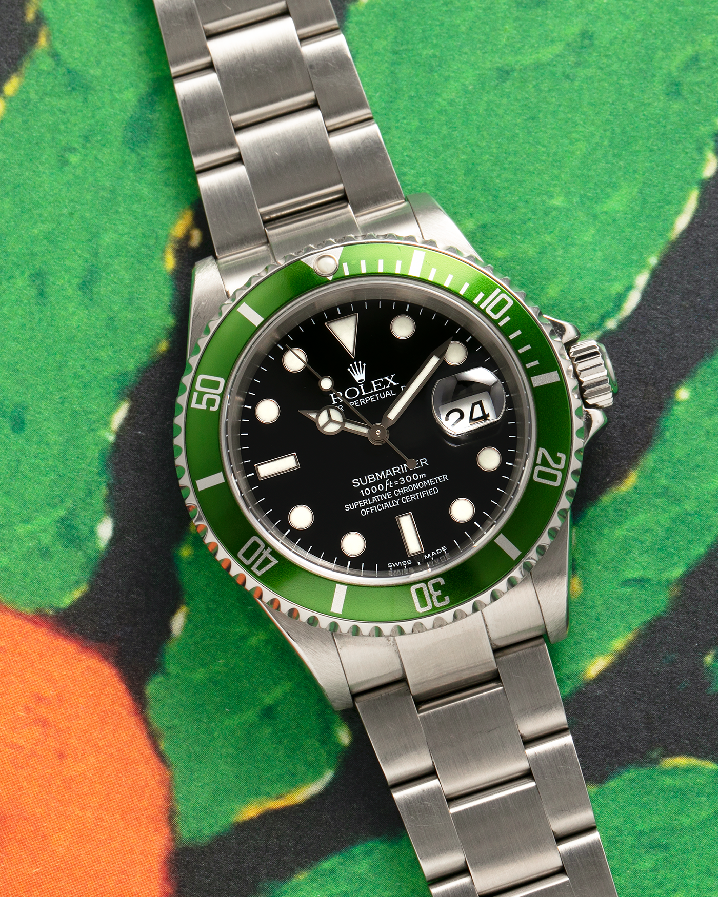 Brand: Rolex Year: 2004 Model: Submariner ‘Kermit’ Reference Number: 16610LV ‘Flat 4’ Serial Number: F Serial Material: Stainless Steel Movement: Rolex Cal. 3135, Self-Winding Case Diameter: 40mm Lug Width: 20mm Bracelet: Rolex Stainless Steel ‘93250’ Oyster Bracelet with signed ‘CL3’ Clasp