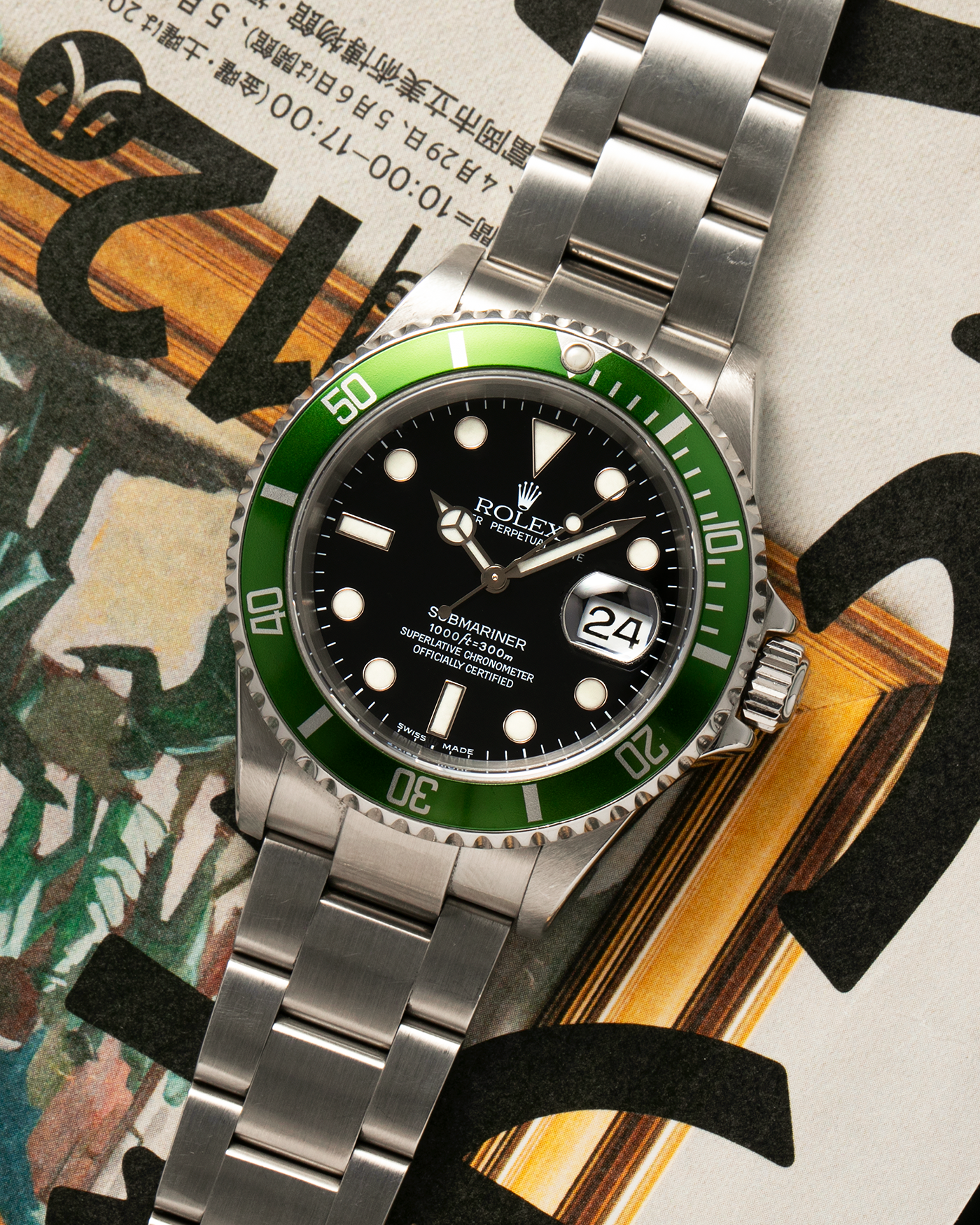 Brand: Rolex Year: 2004 Model: Submariner ‘Kermit’ Reference Number: 16610LV ‘Flat 4’ Serial Number: F Serial Material: Stainless Steel Movement: Rolex Cal. 3135, Self-Winding Case Diameter: 40mm Lug Width: 20mm Bracelet: Rolex Stainless Steel ‘93250’ Oyster Bracelet with signed ‘CL3’ Clasp