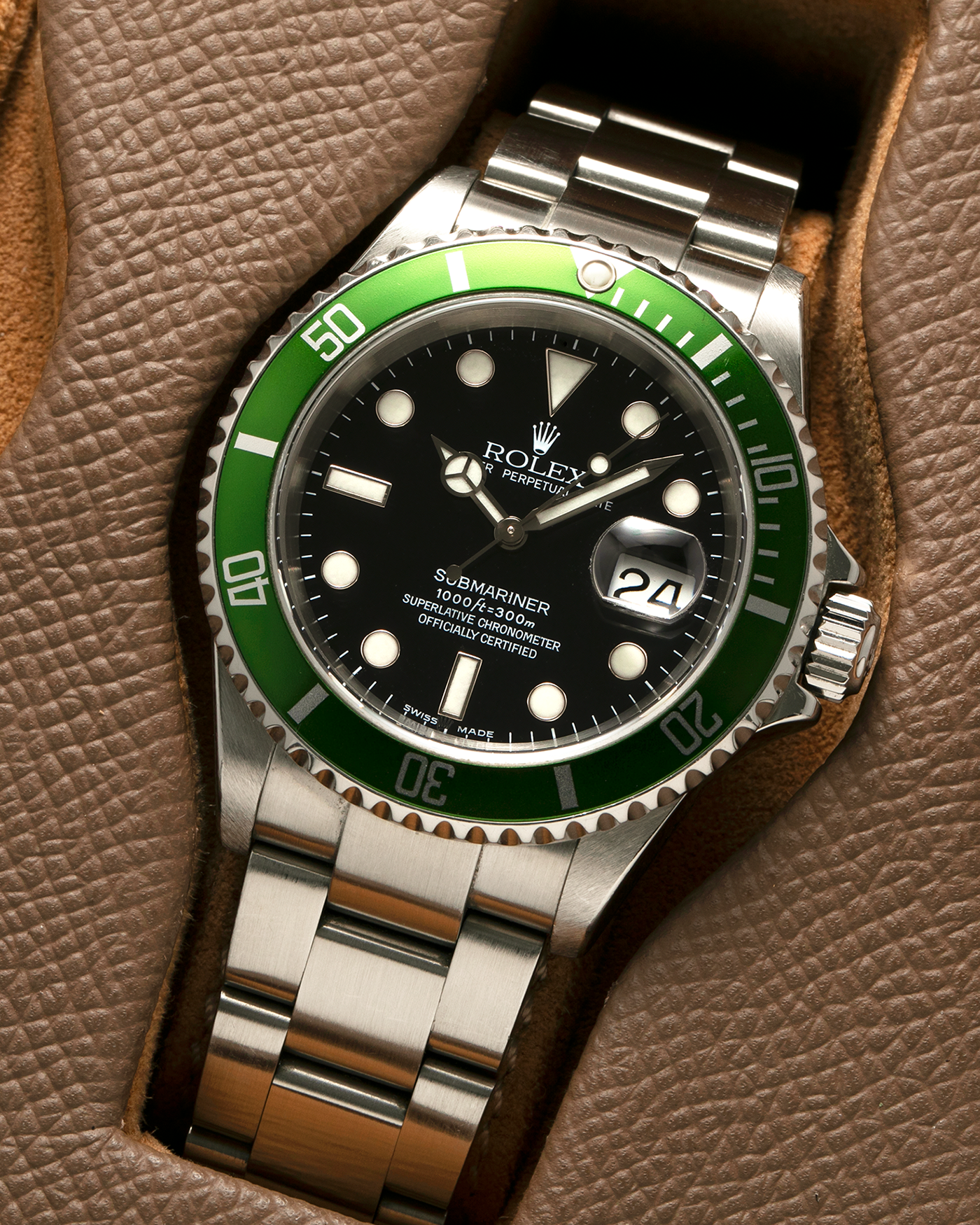 Brand: Rolex Year: 2004 Model: Submariner ‘Kermit’ Reference Number: 16610LV ‘Flat 4’ Serial Number: F Serial Material: Stainless Steel Movement: Rolex Cal. 3135, Self-Winding Case Diameter: 40mm Lug Width: 20mm Bracelet: Rolex Stainless Steel ‘93250’ Oyster Bracelet with signed ‘CL3’ Clasp