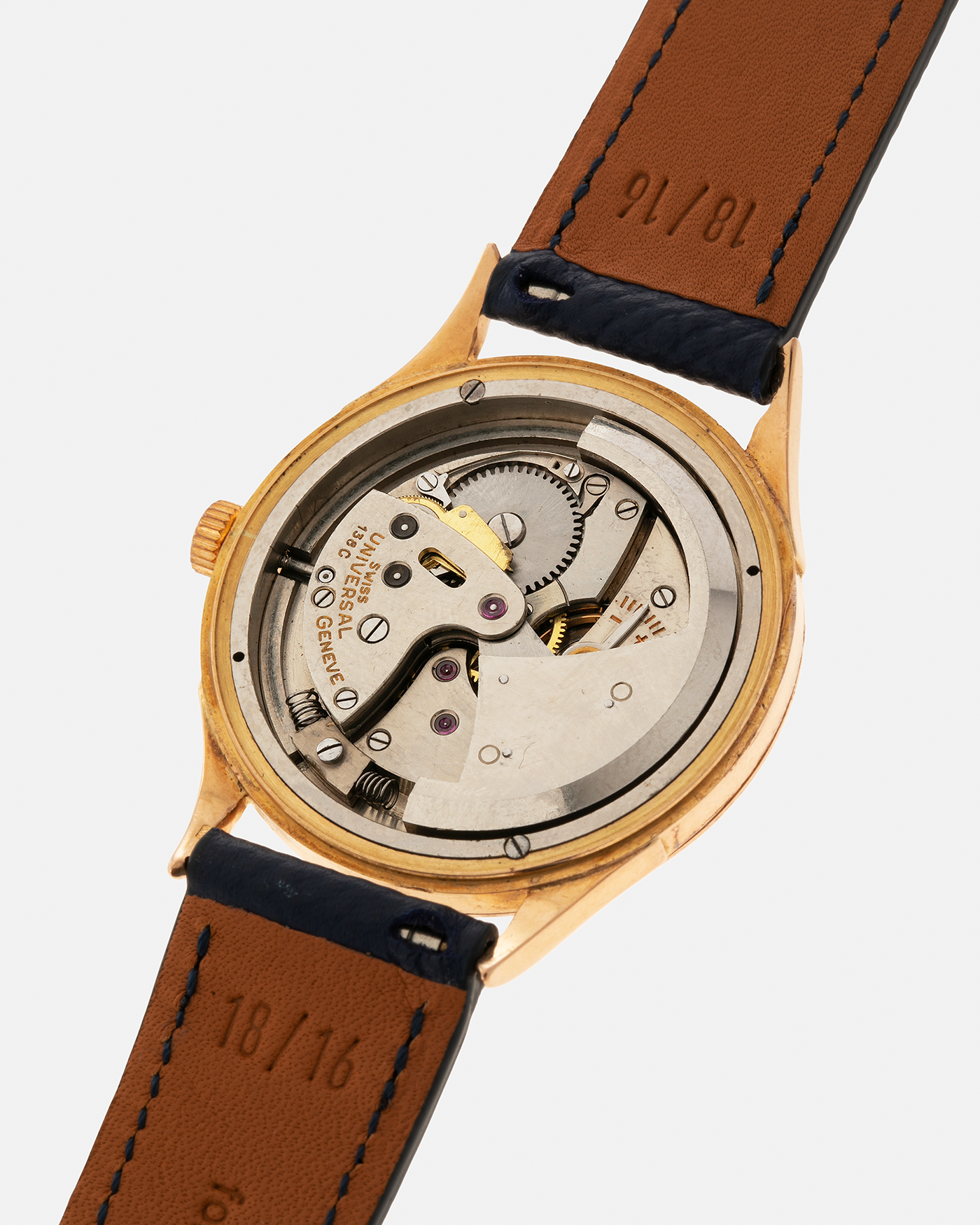 Brand: Universal Genève 
Year: 1950s
Material: 18-carat Yellow Gold
Movement: Universal Genève Cal. 138C, Bumper Self-Winding
Case Dimensions: 35mm x 10.5mm (Lug-to-Lug 43mm)
Lug Width: 18mm
Strap: Nostime Dark Navy Textured Calf Leather Strap 