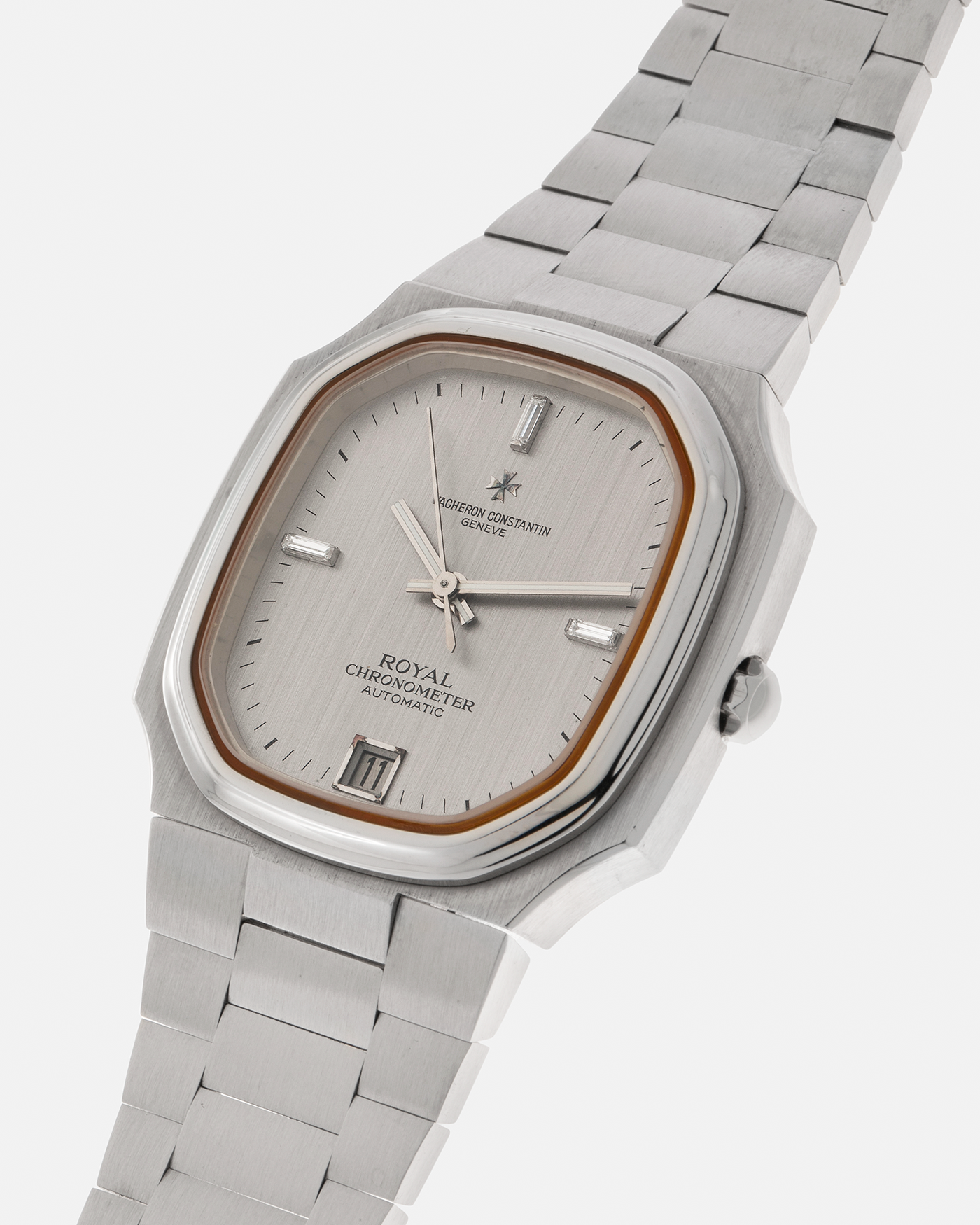 Brand: Vacheron Constantin Year: Mid-1970s Model: Chronometer Royal ‘Diamonds’ Reference Number: 2215 Material: Stainless Steel Case, White Gold Baton Hands, Factory Applied Baguette Diamonds at 3, 9, and 12 o’clock Movement: Vacheron Constantin Cal. 1096, Self-Winding Case Dimensions: 37mm x 10.3mm Bracelet: Vacheron Constantin Stainless Steel Integrated Three-Link Bracelet with Maltese Signed Clasp