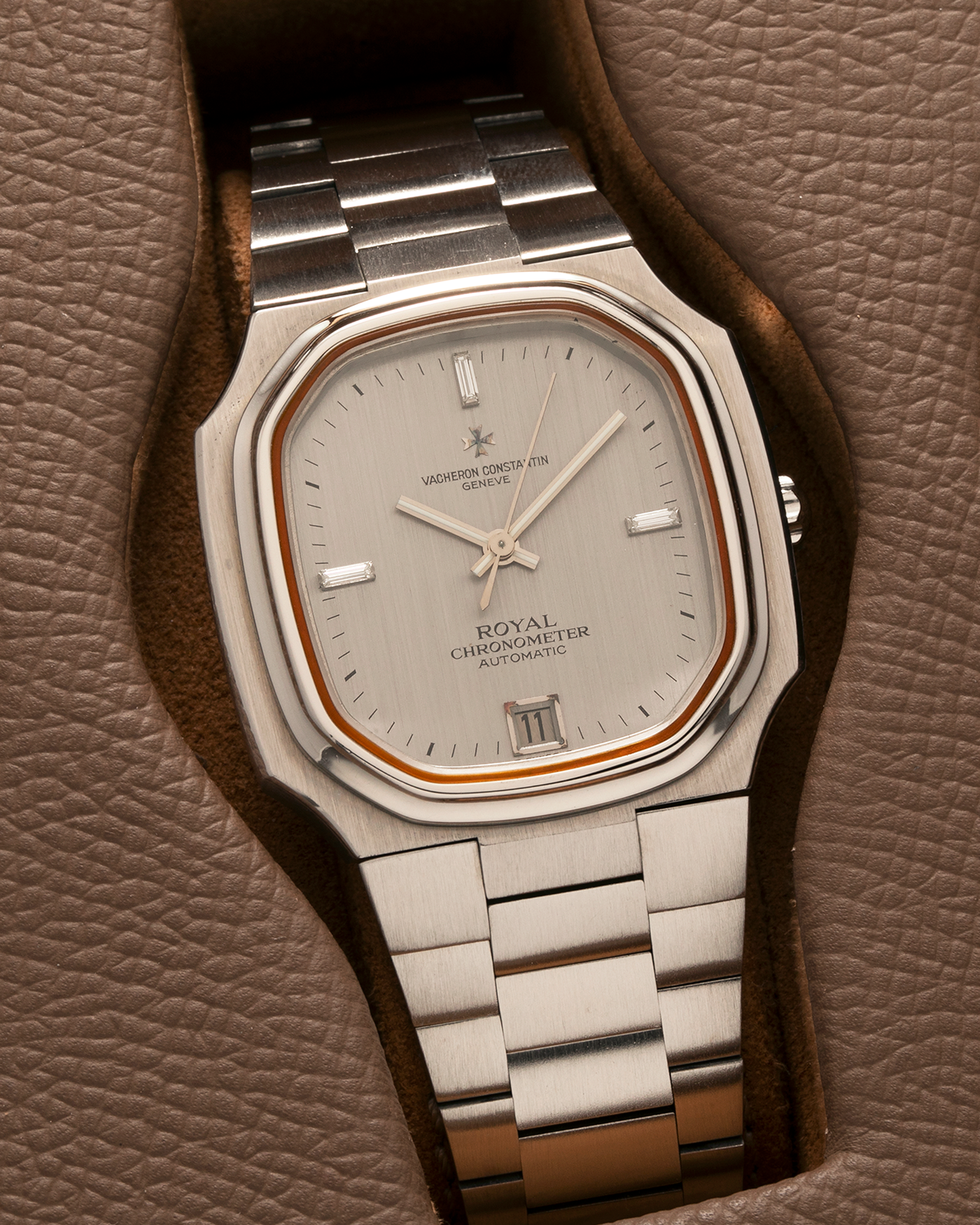 Brand: Vacheron Constantin Year: Mid-1970s Model: Chronometer Royal ‘Diamonds’ Reference Number: 2215 Material: Stainless Steel Case, White Gold Baton Hands, Factory Applied Baguette Diamonds at 3, 9, and 12 o’clock Movement: Vacheron Constantin Cal. 1096, Self-Winding Case Dimensions: 37mm x 10.3mm Bracelet: Vacheron Constantin Stainless Steel Integrated Three-Link Bracelet with Maltese Signed Clasp