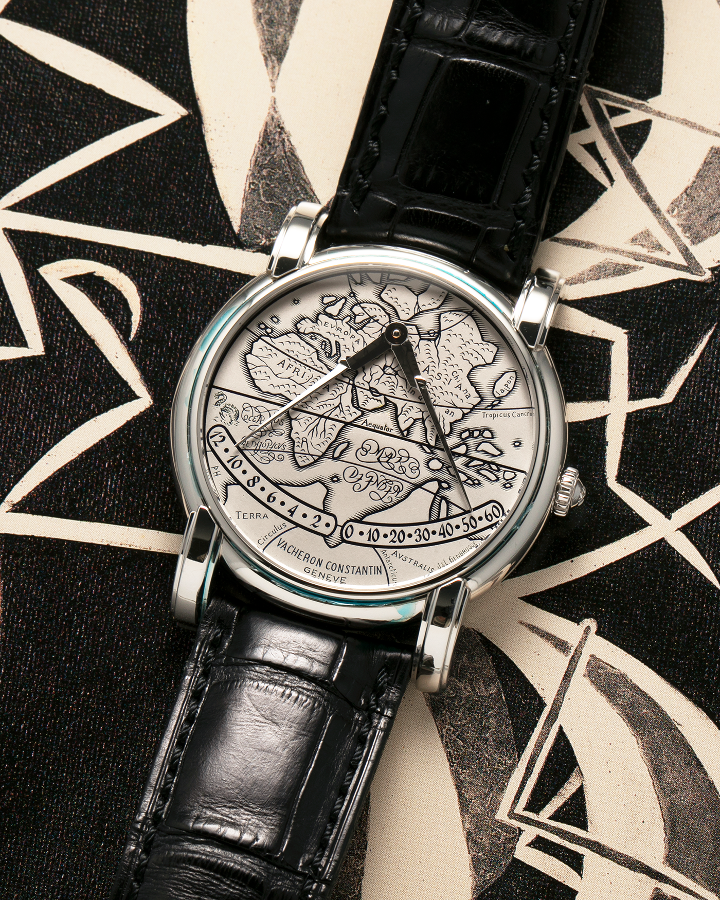 Brand: Vacheron Constantin
Year: 1990s
Model: Mercator
Reference Number: 43050
Material: Platinum 950 Case and Engraved Gold Dial filled with Black Enamel
Movement: Vacheron Constantin Cal. 1120 M (Heavily Modified Jaeger LeCoultre Cal. 920), Self-Winding
Case Diameter: 36mm x 9mm (Lug-to-Lug 41mm)
Lug Width: 19mm
Strap: Vacheron Constantin Black Alligator Leather Strap with Signed Platinum 950 Deployant Clasp