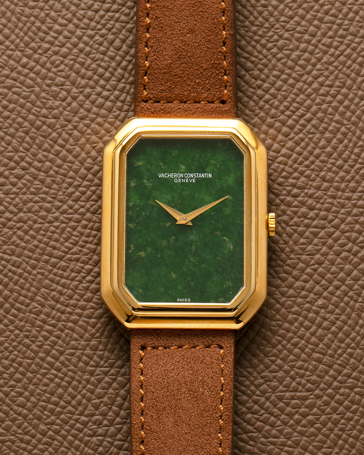 Brand: Vacheron Constantin
Year: 1970s
Reference: 2077
Material: 18-carat Yellow Gold Case, Jade Dial
Movement: Vacheron Constantin Cal. K1014 (Based on Jaeger LeCoultre Cal. 818), Manual-Winding
Case Dimensions: 38mm (Including Lugs) x 29mm x 6.5mm
Lug Width: 18mm
Strap: Molequin Brown Suede Leather Strap with Generic Gold Tang Buckle