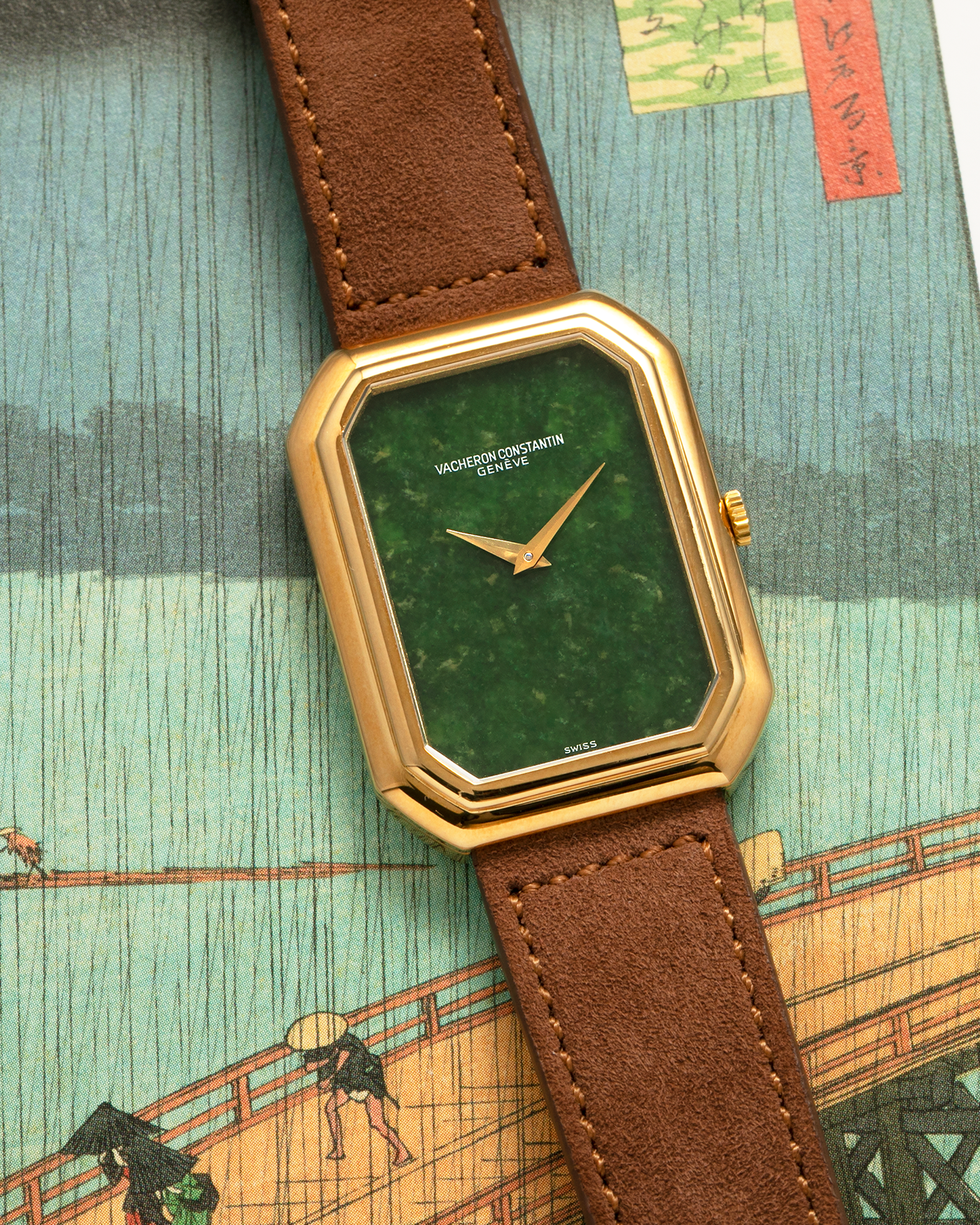 Brand: Vacheron Constantin
Year: 1970s
Reference: 2077
Material: 18-carat Yellow Gold Case, Jade Dial
Movement: Vacheron Constantin Cal. K1014 (Based on Jaeger LeCoultre Cal. 818), Manual-Winding
Case Dimensions: 38mm (Including Lugs) x 29mm x 6.5mm
Lug Width: 18mm
Strap: Molequin Brown Suede Leather Strap with Generic Gold Tang Buckle
