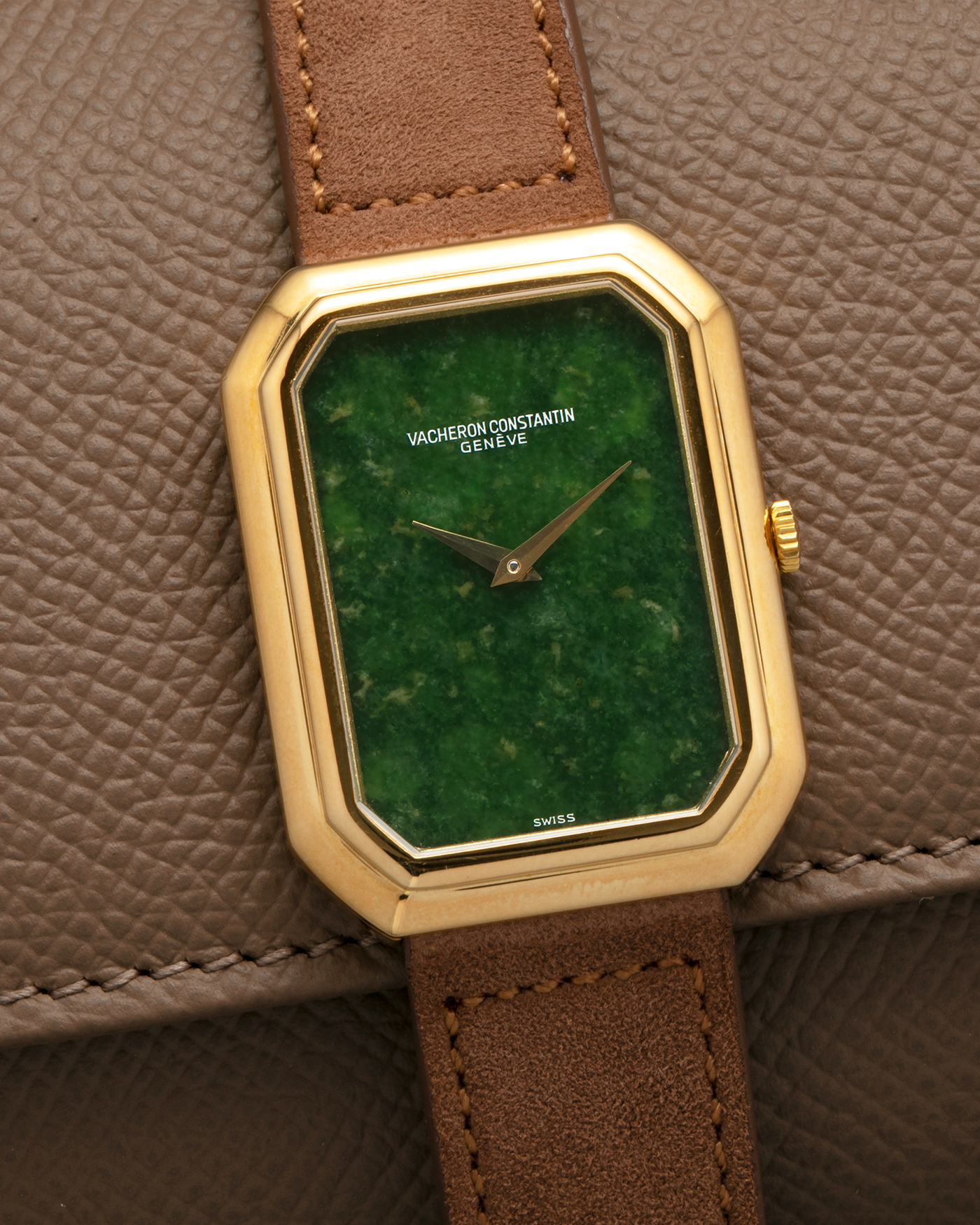 Brand: Vacheron Constantin
Year: 1970s
Reference: 2077
Material: 18-carat Yellow Gold Case, Jade Dial
Movement: Vacheron Constantin Cal. K1014 (Based on Jaeger LeCoultre Cal. 818), Manual-Winding
Case Dimensions: 38mm (Including Lugs) x 29mm x 6.5mm
Lug Width: 18mm
Strap: Molequin Brown Suede Leather Strap with Generic Gold Tang Buckle