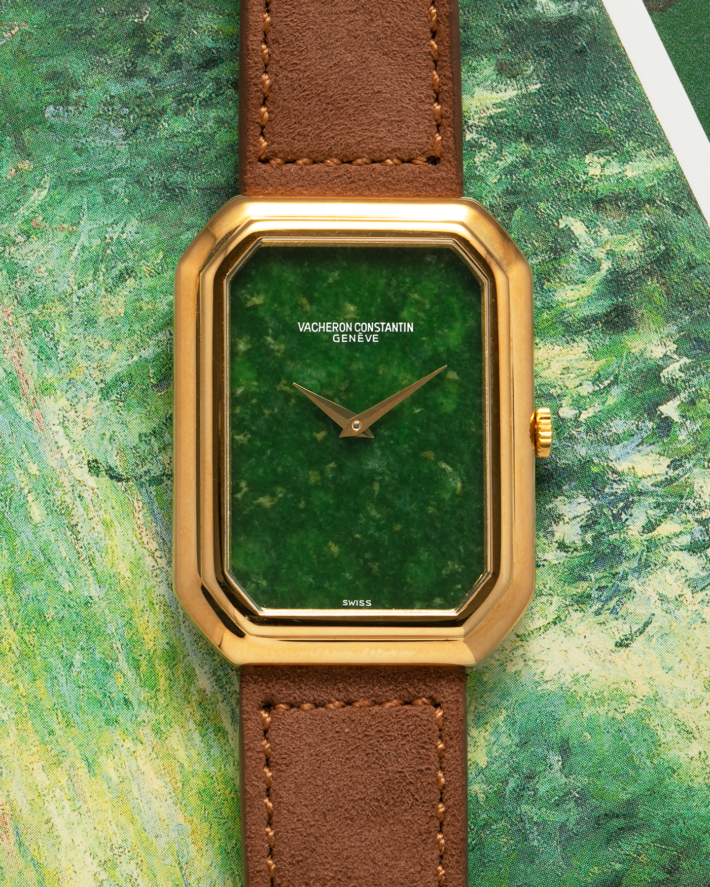 Brand: Vacheron Constantin
Year: 1970s
Reference: 2077
Material: 18-carat Yellow Gold Case, Jade Dial
Movement: Vacheron Constantin Cal. K1014 (Based on Jaeger LeCoultre Cal. 818), Manual-Winding
Case Dimensions: 38mm (Including Lugs) x 29mm x 6.5mm
Lug Width: 18mm
Strap: Molequin Brown Suede Leather Strap with Generic Gold Tang Buckle