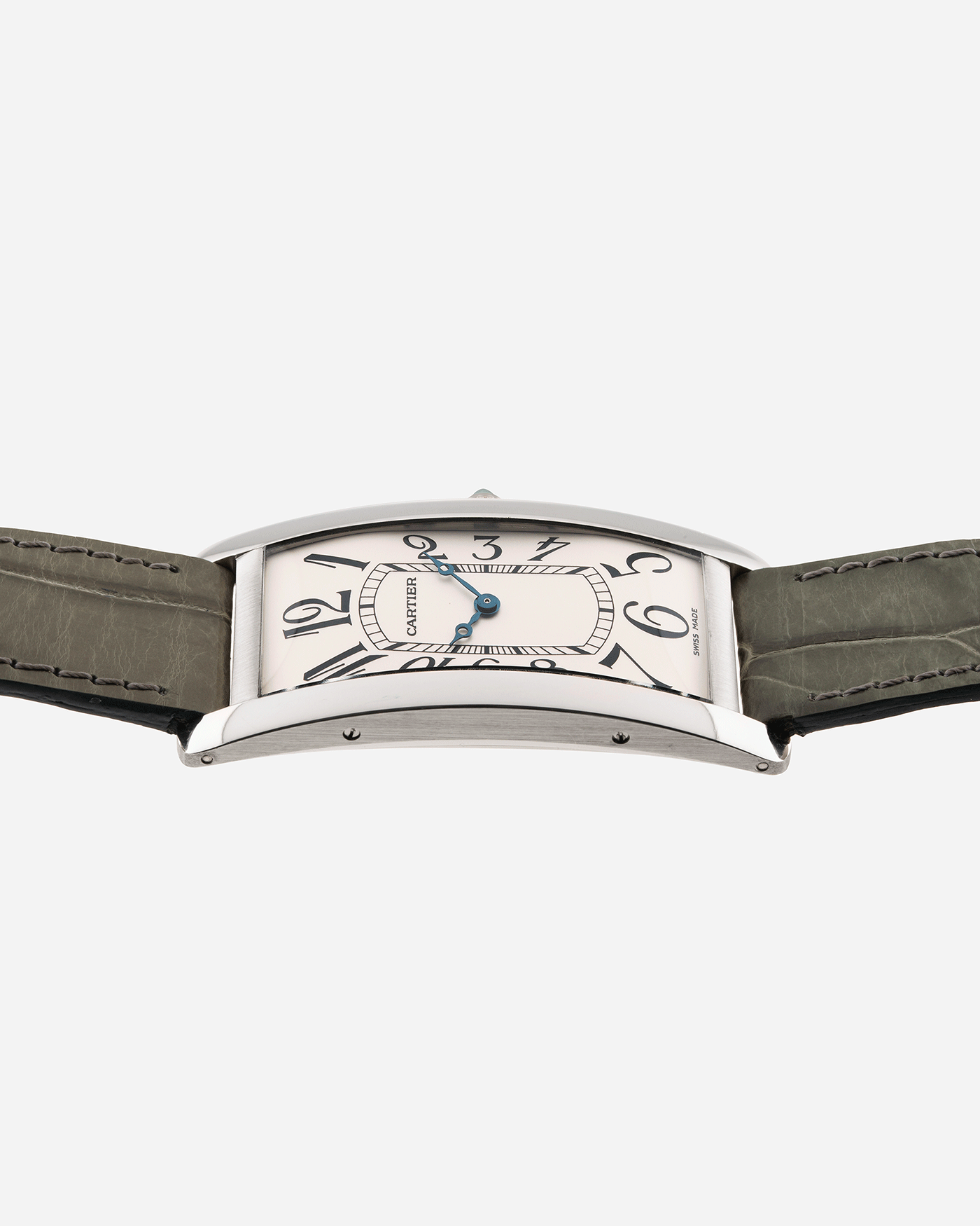 Brand: Cartier Year: 2005 Model: CPCP Collection Prive Tank Cintree Reference: 2843 Material: Platinum Movement: Jaeger Le Coultre manual wind caliber 9770MC Case Diameter: 46 x 23 mm Strap: Moss Green Alligator Strap with Platinum Cartier Deployant Clasp