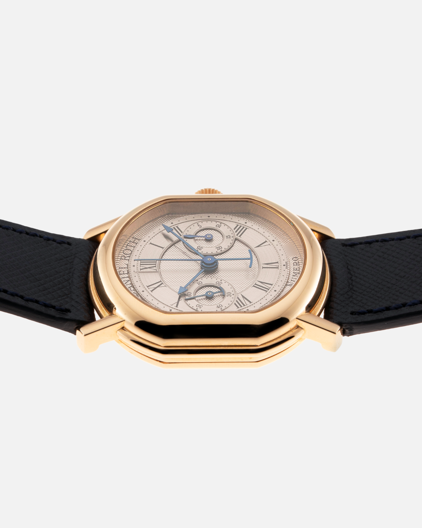 Brand: Daniel Roth Year: 1990’s Model: C147 Material: 18k Yellow Gold Movement: Lemania 2320 Case Diameter: 35mm X 38mm Strap: Molequin Navy Blue Textured Calf Strap and 18k Yellow Gold Daniel Roth Tang Buckle